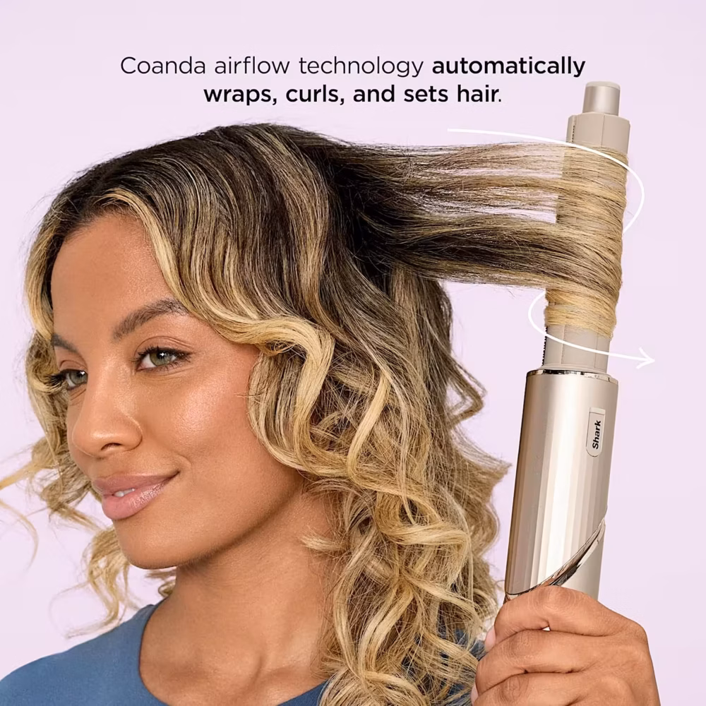Woman using Shark FlexStyle curler — Coanda airflow technology automatically wraps, curls, and sets hair